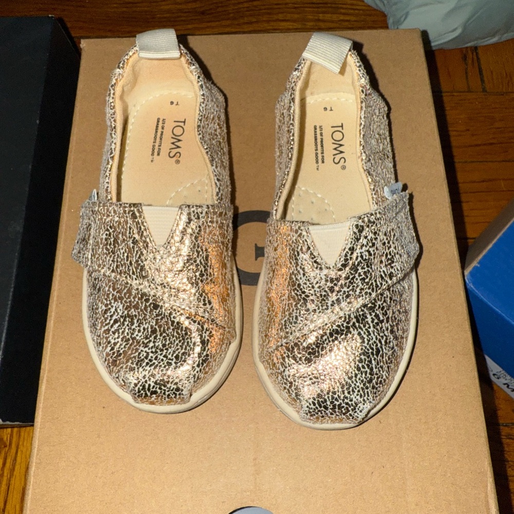 TOMS Metallic Gold Textured Slip-Ons